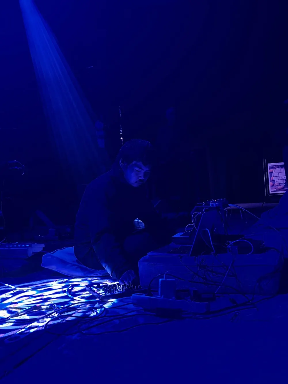 Performing in deep blue light.